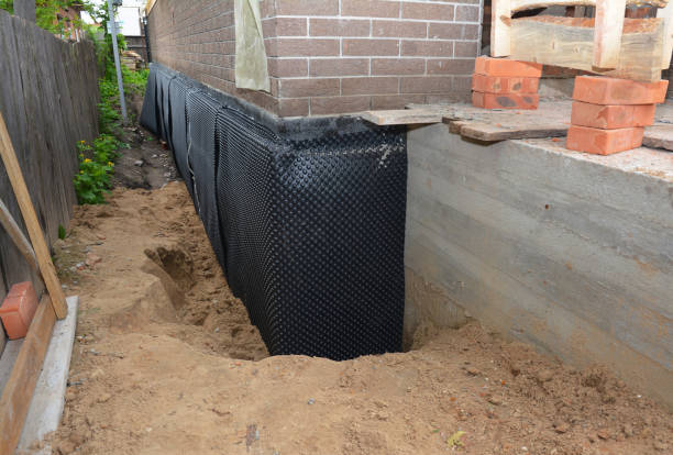 Happy homeowners after waterproofing job in Bristow